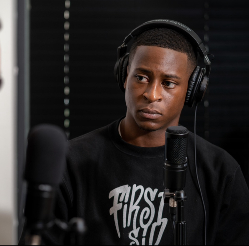 Dekimbe Smith recording First Sip Podcast